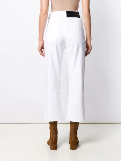 Shop Loewe Cropped Jeans In White