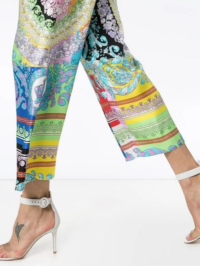 Shop Versace Mixed Floral Print Cropped Trousers In A7000 Multicolor