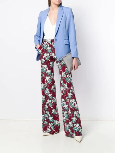 Shop Valentino Floral Print Trousers In Red