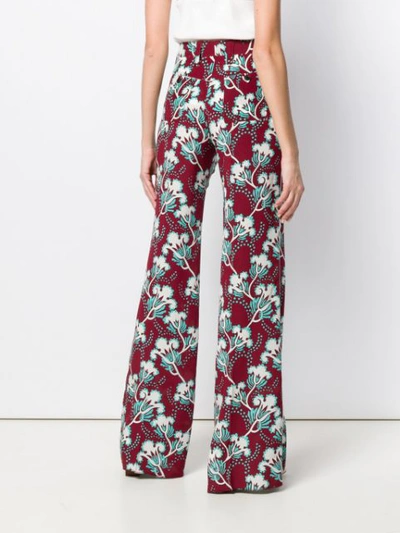 Shop Valentino Floral Print Trousers In Red