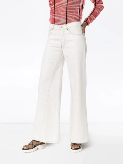 Shop Ganni Wide-leg Denim Jeans In White