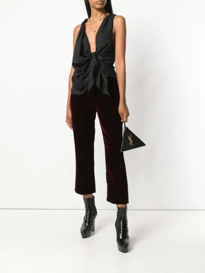 Saint Laurent Burgundy Mid Rise Flared Velvet Trousers In Red