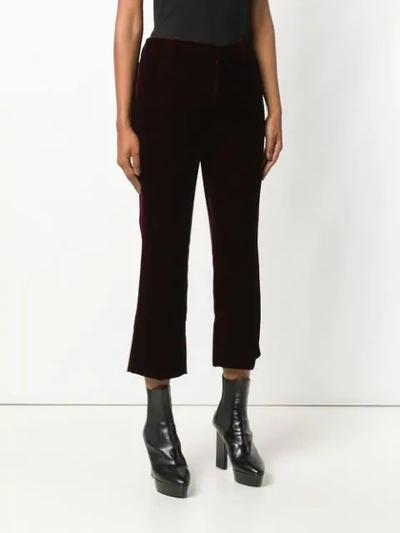 Saint Laurent Burgundy Mid Rise Flared Velvet Trousers In Red