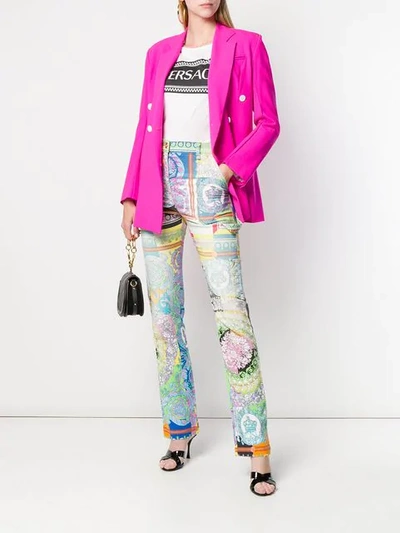 Shop Versace Technicolor Baroque Print Jeans In White