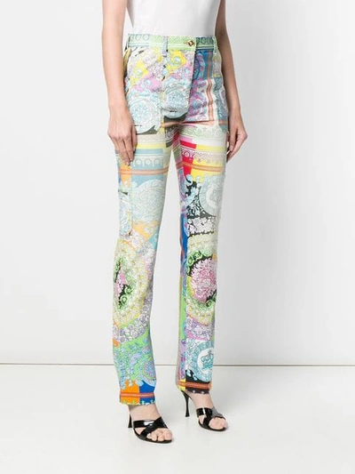 Shop Versace Technicolor Baroque Print Jeans In White