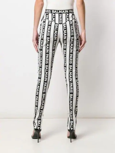 Shop Balmain Striped Logo Trousers In Black