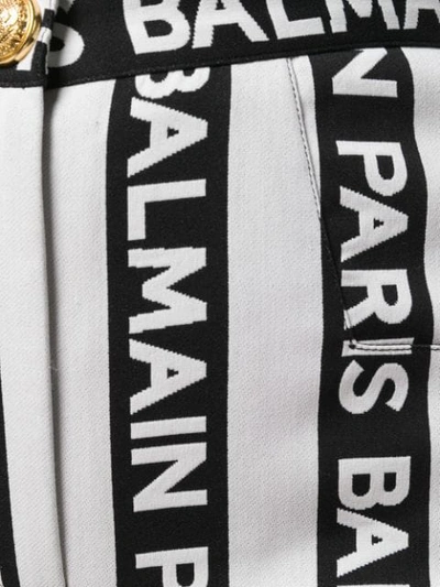 Shop Balmain Striped Logo Trousers In Black