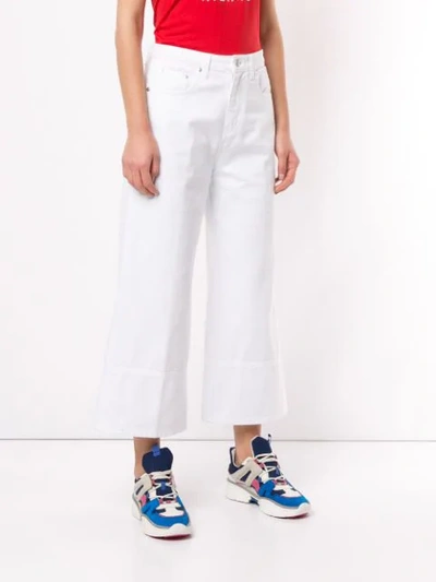 Shop Msgm Cropped Flared Jeans In White