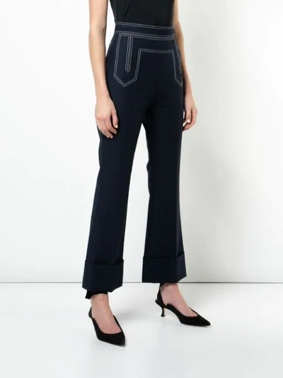 Shop Khaite Stitch Detail Flared Trousers In Blue