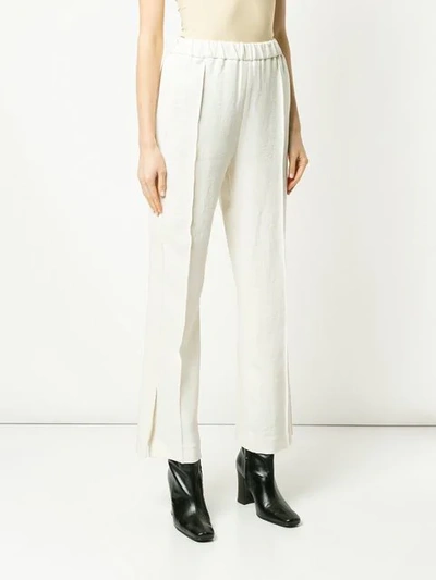 Shop Sykes Bootcut Trousers In Cream