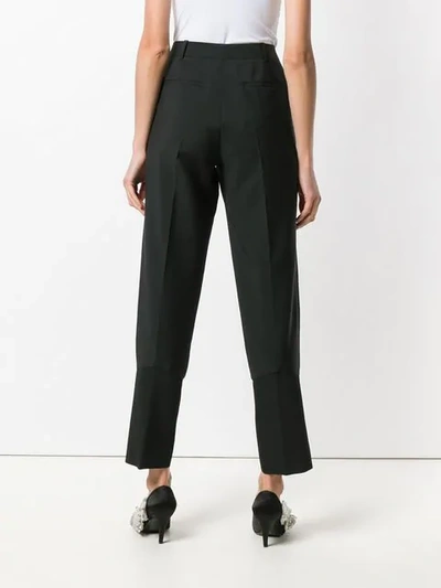 Shop Givenchy Tapered Trousers In Black