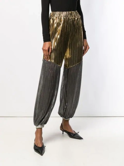 Shop Atu Body Couture Pleated Tapered Trousers In Gold