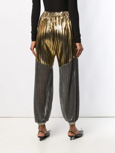 Shop Atu Body Couture Pleated Tapered Trousers In Gold