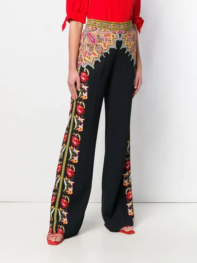 Shop Etro Printed Flared Trousers In Black