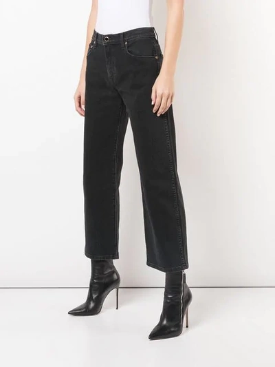 Shop Khaite Cropped Jeans In Black