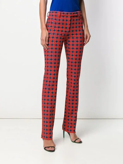 Shop Versace Printed Tailored Trousers In Red