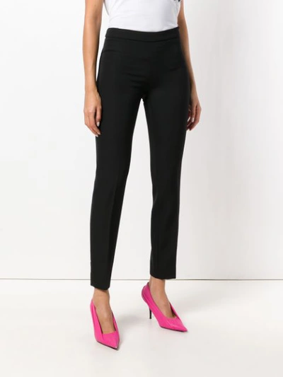 Shop Moschino Flat Front Cropped Slim Trousers - Black