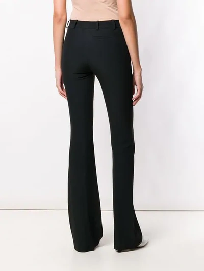 Shop Alexander Mcqueen Long Flared Trousers - Black