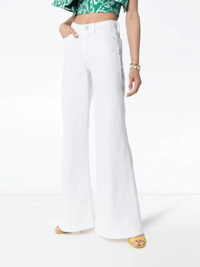Shop Frame Braid Waistband Flared Jeans In White