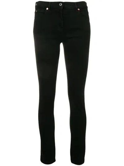 Shop Valentino Vlogo Skinny Jeans In Black