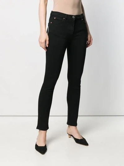 Shop Valentino Vlogo Skinny Jeans In Black