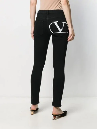 Shop Valentino Vlogo Skinny Jeans In Black