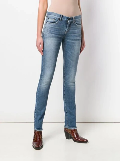 Shop Saint Laurent Low-rise Skinny Jeans In Blue