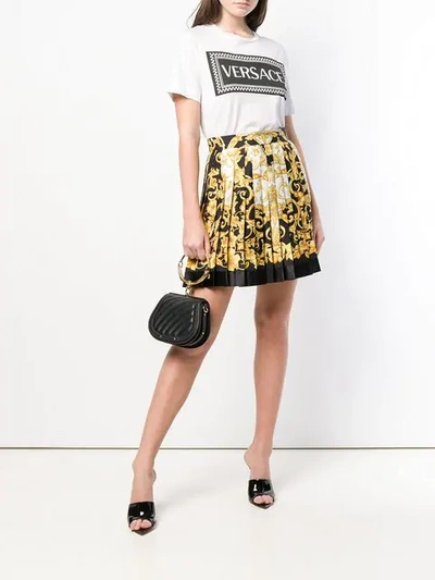Shop Versace Baroque Print Pleated Mini Skirt In Yellow