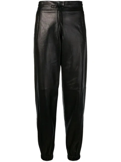Shop Saint Laurent Drawstring Trousers In Black