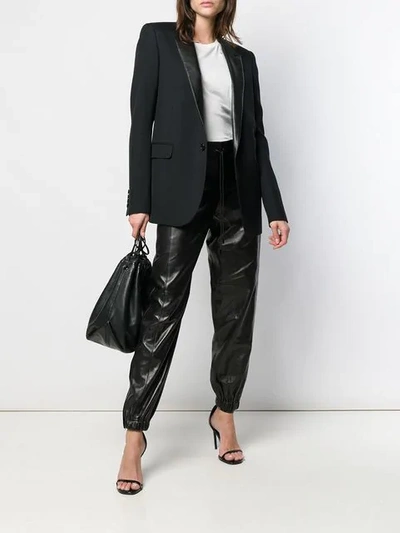 Shop Saint Laurent Drawstring Trousers In Black
