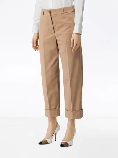 Shop Burberry Icon Stripe Detail Stretch Cotton Cropped Trousers In Brown