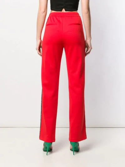 Shop Pinko Flared Track Trousers In Red