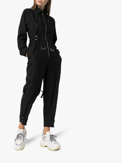 Shop Stella Mccartney Pinstripe Buckle Detail Jumpsuit In 101 - Black