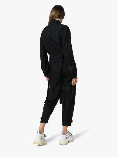 Shop Stella Mccartney Pinstripe Buckle Detail Jumpsuit In 101 - Black