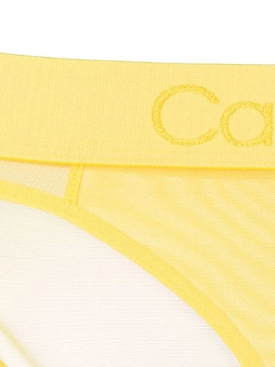 Shop Calvin Klein Sheer Briefs - Yellow