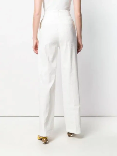 Shop Pinko Flared Tailored Trousers In White