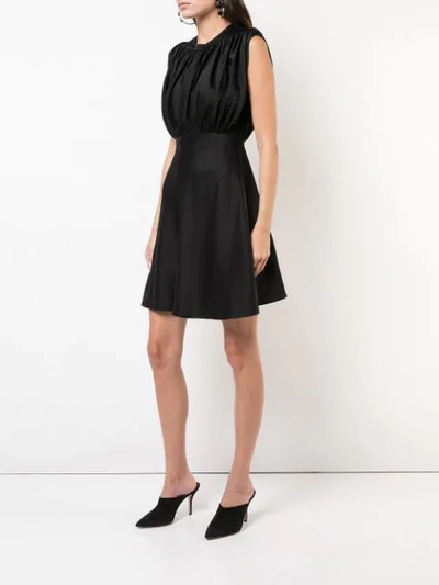 Shop Khaite Sleeveless Flared Dress In Black