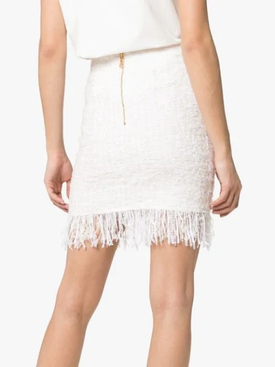 Shop Balmain Tweed Shredded Hem Gold Tone Button Skirt In White