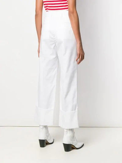 Shop Msgm Fold-up Hem Trousers In White