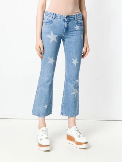 Shop Stella Mccartney Star Print Cropped Jeans In Blue