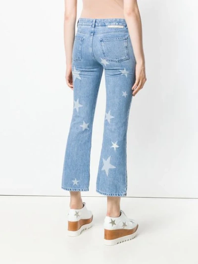 Shop Stella Mccartney Star Print Cropped Jeans In Blue