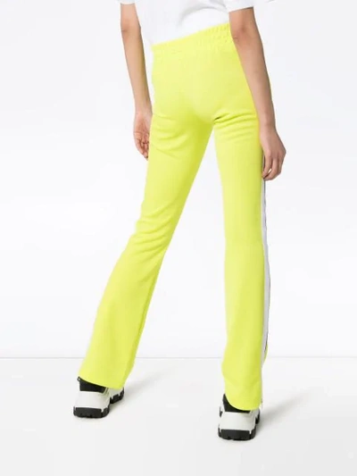 Shop Palm Angels Side-stripe Flared Track Pants In Green