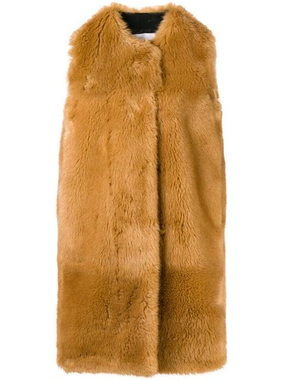 Shop Msgm Faux Fur Long Gilet In Brown