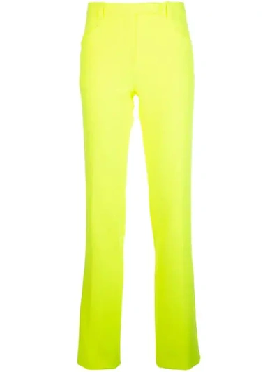 Shop Versace Slim-fit Trousers In Yellow