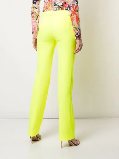 Shop Versace Slim-fit Trousers In Yellow