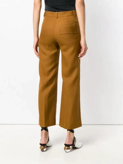Shop Victoria Beckham Flared Cropped Tailored Trousers In Orange