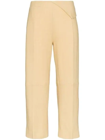 Shop Jacquemus Pleat Front Waist Detail Cotton Trousers In Pale Yellow