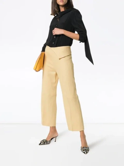 Shop Jacquemus Pleat Front Waist Detail Cotton Trousers In Pale Yellow