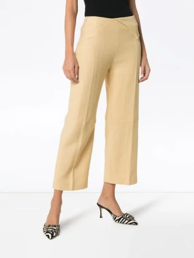 Shop Jacquemus Pleat Front Waist Detail Cotton Trousers In Pale Yellow