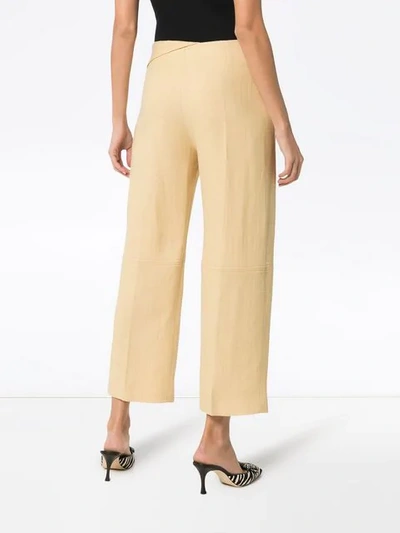 Shop Jacquemus Pleat Front Waist Detail Cotton Trousers In Pale Yellow